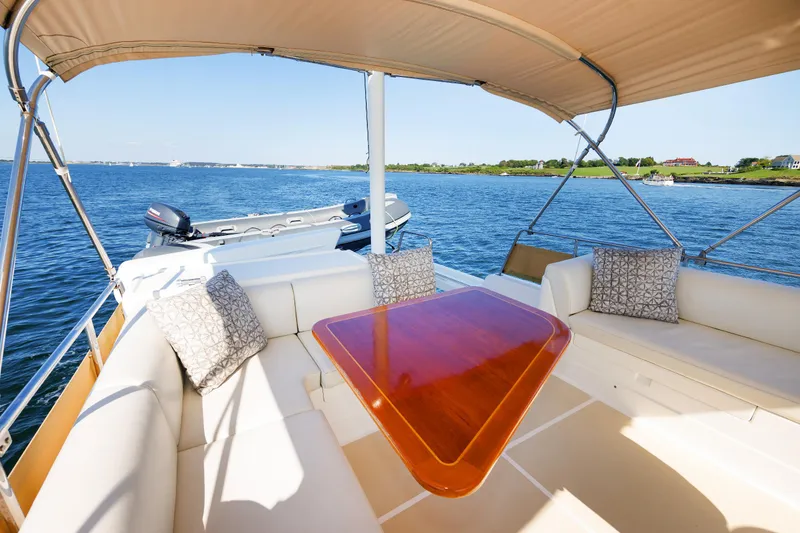 Slide: The Image of Luxurious 2014 Grand Banks 43 Europa yacht with elegant seating and scenic water view. - 35