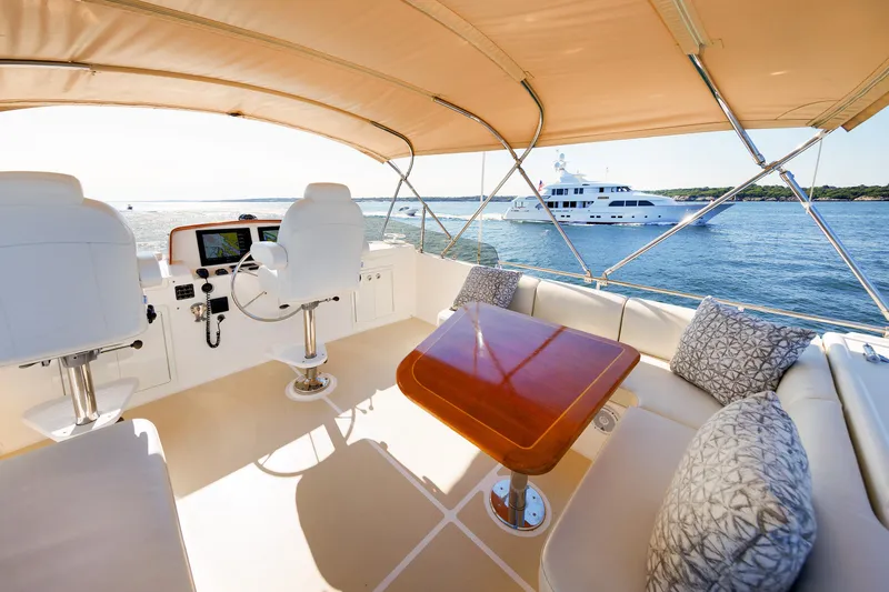 Slide: The Image of Luxurious 2014 Grand Banks 43 Europa yacht interior with helm, seating, and ocean view. - 37