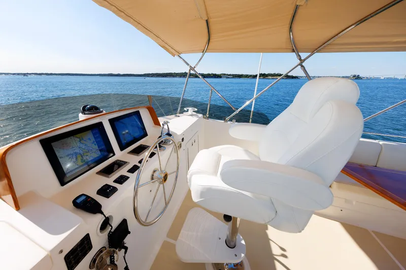Slide: The Image of Grand Banks 43 Europa 2014 yacht helm with navigation screens and white captain's chair. - 41