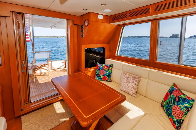 Slide: The Image of Interior of 2014 Grand Banks 43 Europa yacht with ocean view and cozy seating area. - 46