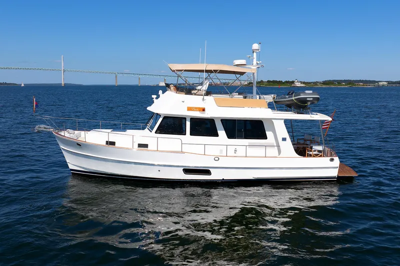 Slide: The Image of 2014 Grand Banks 43 Europa yacht on calm blue water. - 5