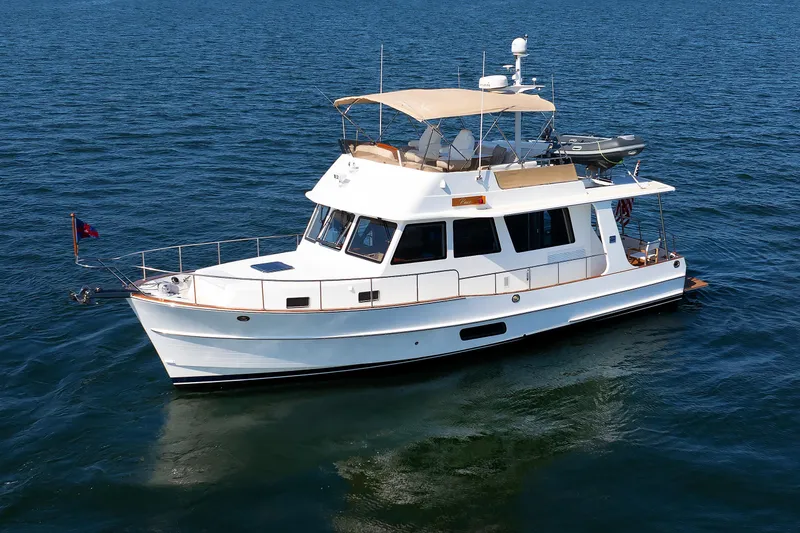 Slide: The Image of 2014 Grand Banks 43 Europa yacht cruising on open water. - 7