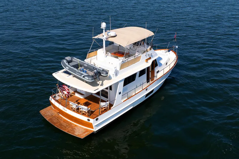 Slide: The Image of Grand Banks 43 Europa 2014 yacht on open water, featuring spacious deck and elegant design. - 8