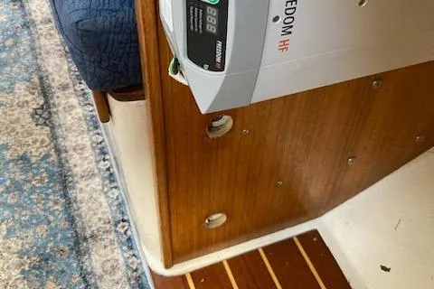 Slide: The Image of Interior of 1998 Catalina 36 MkII sailboat with wooden paneling and electronic equipment. - 11