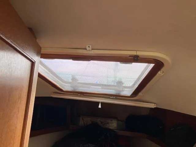 Slide: The Image of Interior view of a 1998 Catalina 36 MkII sailboat hatch with natural light. - 13