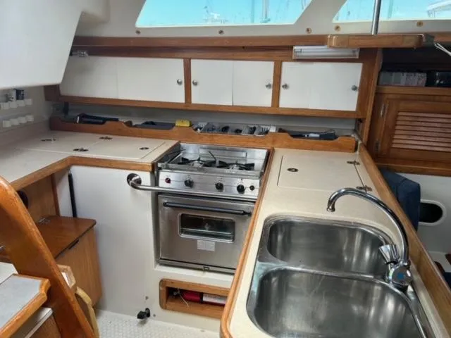 Slide: The Image of Interior of 1998 Catalina 36 MkII sailboat kitchen with stove and sink. - 8