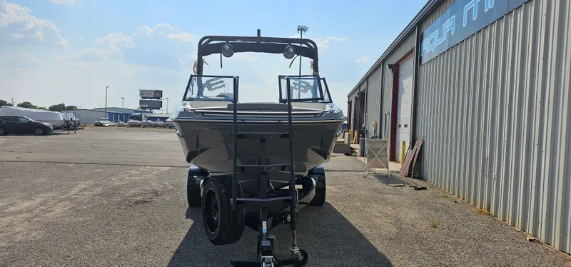 Slide: The Image of 2024 Heyday H20 boat on trailer outside a warehouse. - 3