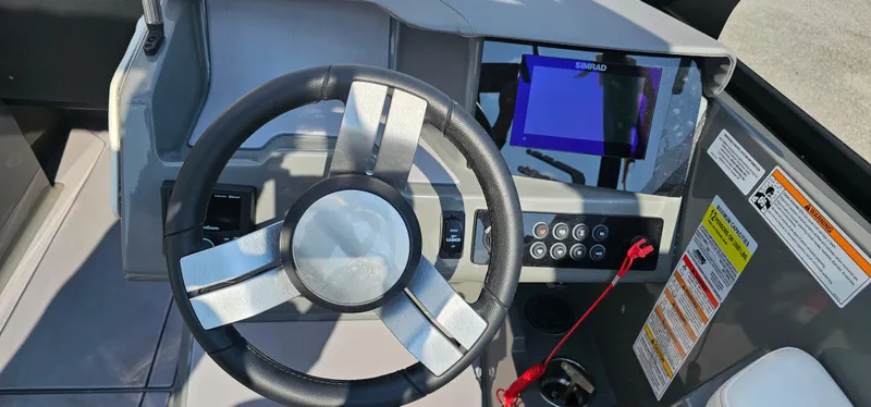 Slide: The Image of 2024 Heyday H20 boat dashboard with steering wheel and control panel. - 7