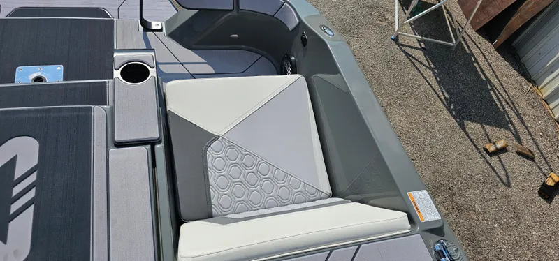 Slide: The Image of 2024 Heyday H20 boat interior with gray seating and cup holder. - 9