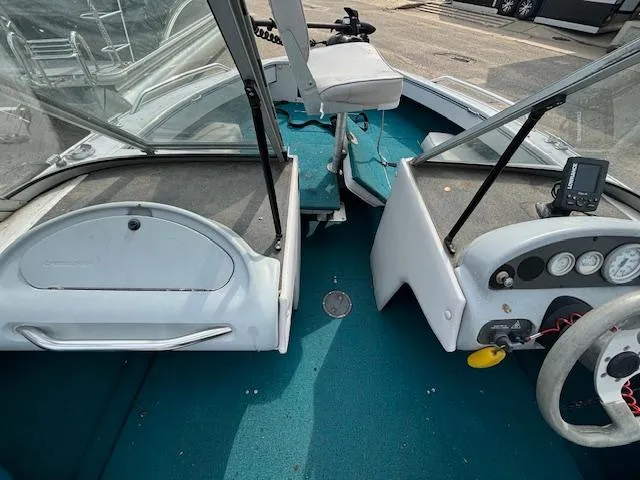 Slide: The Image of 1995 Crestliner 1750 Sport Fish boat interior with steering console and seating. - 19