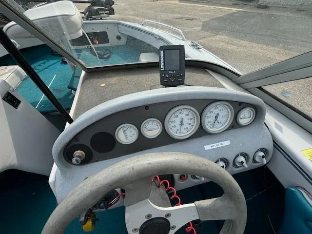 Slide: The Image of 1995 Crestliner 1750 SPORT FISH dashboard with gauges and steering wheel. - 21
