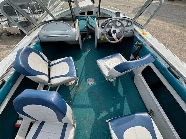 Slide: The Image of 1995 Crestliner 1750 SPORT FISH boat interior with blue and white seating. - 24