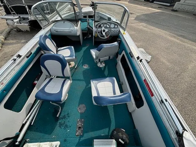 Slide: The Image of 1995 Crestliner 1750 Sport Fish boat interior with blue and white seating. - 25