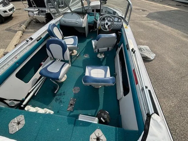 Slide: The Image of 1995 Crestliner 1750 SPORT FISH boat interior with blue and white seating. - 26