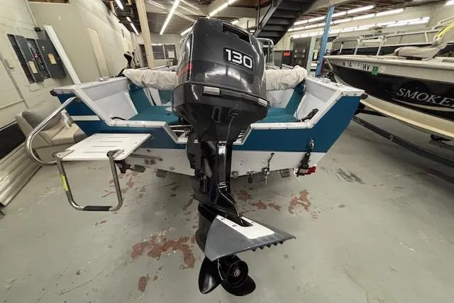 Slide: The Image of 1995 Crestliner 1750 SPORT FISH boat with 130 HP outboard motor in a garage. - 3