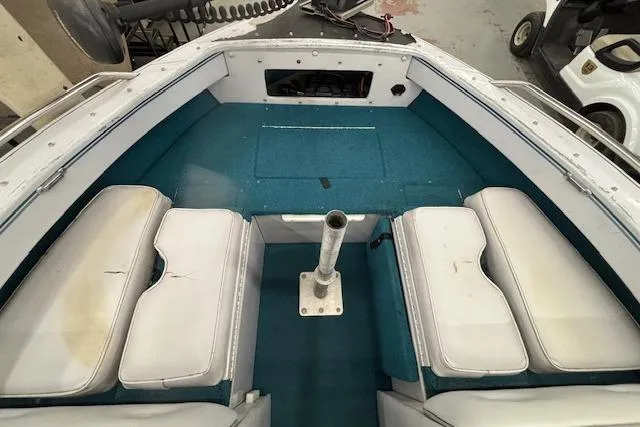 Slide: The Image of 1995 Crestliner 1750 SPORT FISH boat interior with blue carpet and white seating. - 37