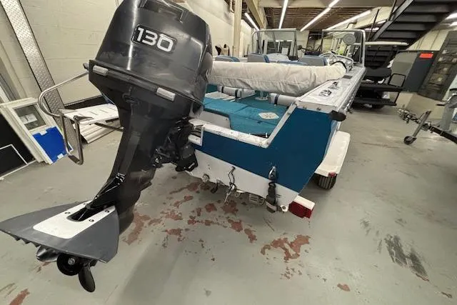 Slide: The Image of 1995 Crestliner 1750 SPORT FISH boat with 130 HP outboard motor in a garage. - 4
