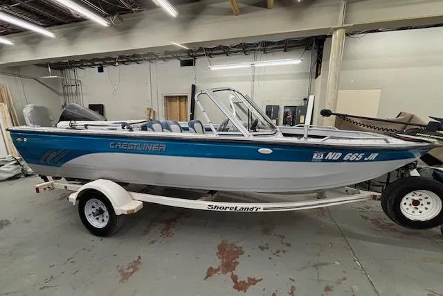 Slide: The Image of 1995 Crestliner 1750 SPORT FISH boat on ShoreLand'r trailer in indoor storage. - 5
