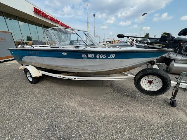 Slide: The Image of 1995 Crestliner 1750 Sport Fish boat on trailer, parked outdoors. - 7