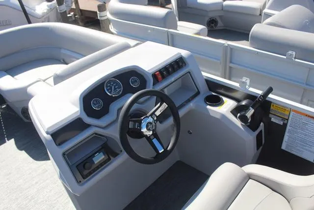 Slide: The Image of 2025 Godfrey Pontoons Xperience 1680 CX dashboard with steering wheel and controls. - 6