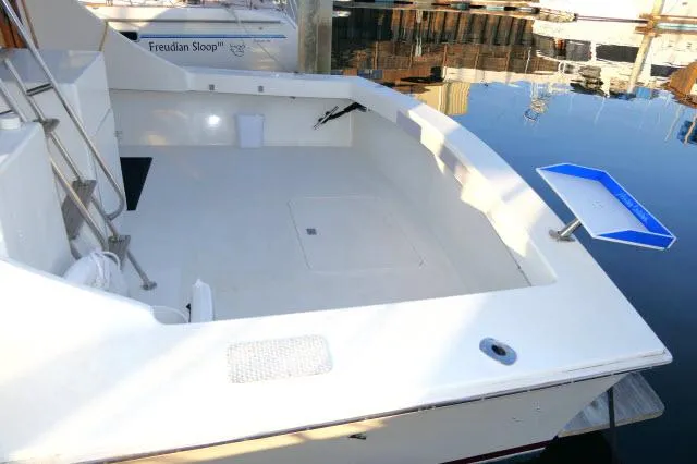 Slide: The Image of 1988 Jersey 36 Convertible Sportfisher bathroom with wooden cabinetry and compact design. - 21