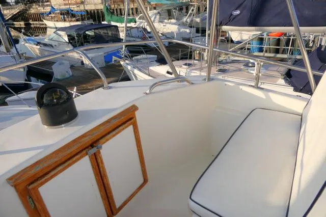 Slide: The Image of 1988 Jersey 36 Convertible Sportfisher bathroom with wooden cabinetry and sink. - 22