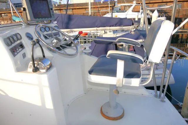 Slide: The Image of Shower area inside 1988 Jersey 36 Convertible Sportfisher boat, featuring controls and handheld showerhead. - 25