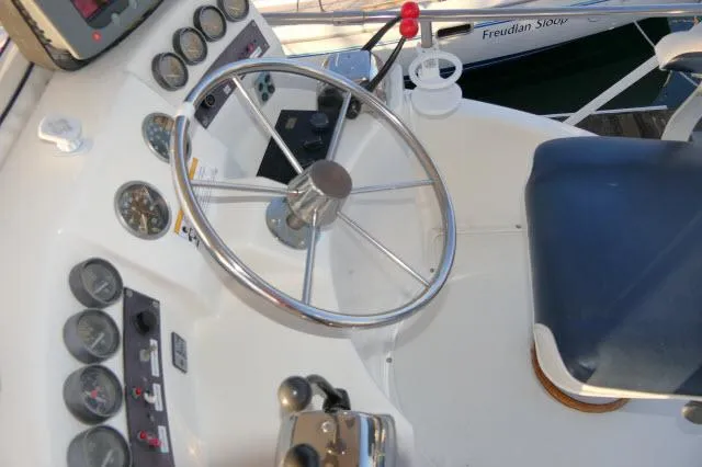Slide: The Image of 1988 Jersey 36 Convertible Sportfisher boat with ladder and fishing rod holders. - 27