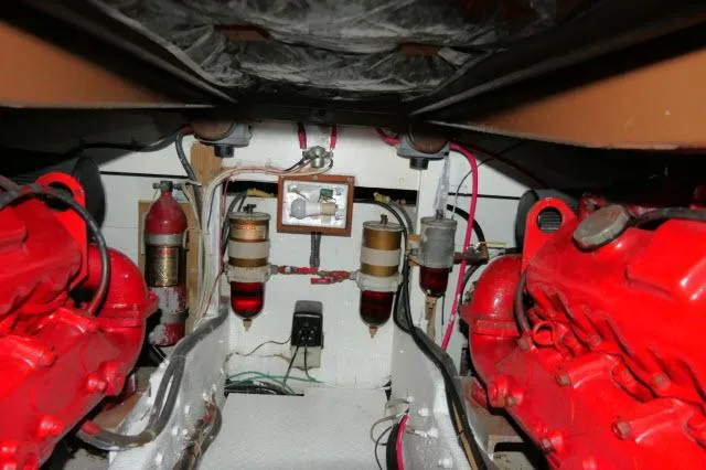 Slide: The Image of 1988 Jersey 36 Convertible Sportfisher boat docked, featuring spacious deck and clean design. - 28