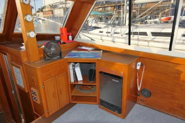 Slide: The Image of Interior of 1988 Jersey 36 Convertible Sportfisher with chair, desk, and mini fridge. - 3
