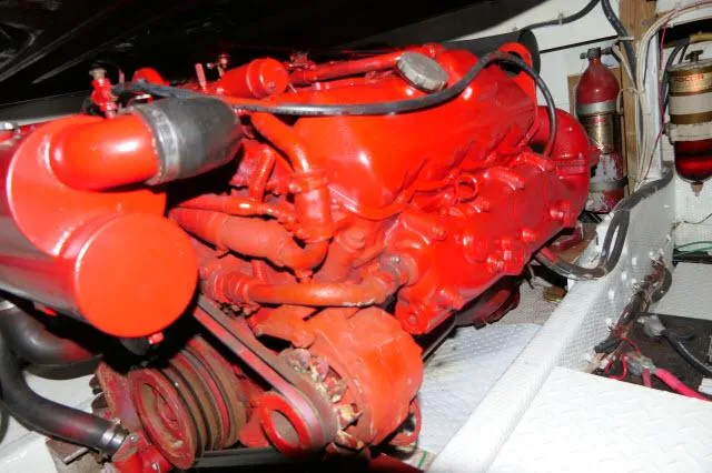 Slide: The Image of 1988 Jersey 36 Convertible Sportfisher helm with controls, gauges, and seating in a marina setting. - 31