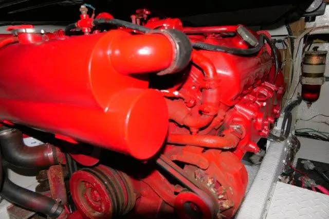 Slide: The Image of 1988 Jersey 36 Convertible Sportfisher helm with controls and seating, docked at marina. - 32