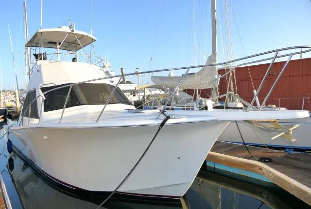 Slide: The Image of 1988 Jersey 36 Convertible Sportfisher helm with steering wheel and gauges. - 34