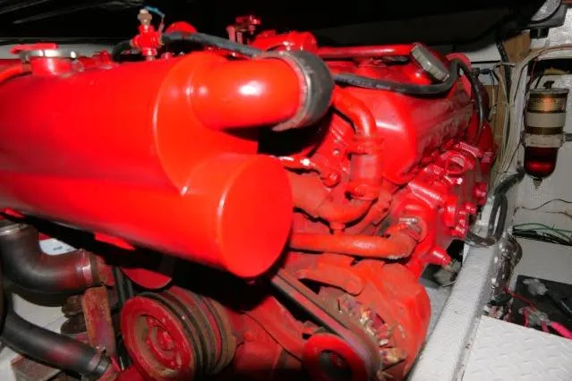 Slide: The Image of Red engine of a 1988 Jersey 36 Convertible Sportfisher boat, detailed view. - 39