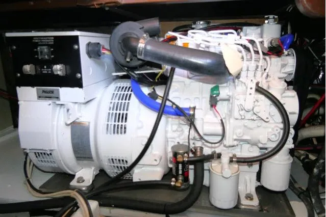 Slide: The Image of Engine compartment of a 1988 Jersey 36 Convertible Sportfisher boat, showcasing mechanical components. - 40