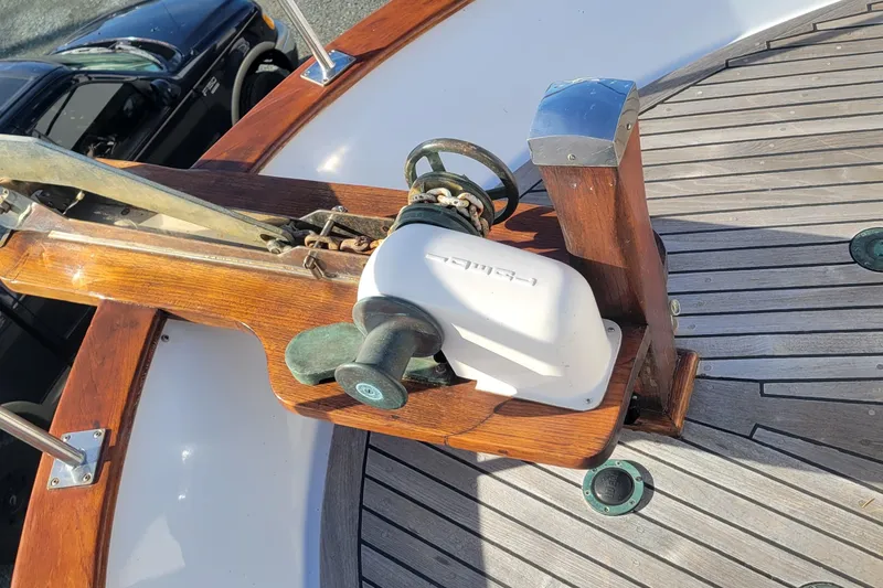Slide: The Image of 1982 CHB Oceans boat deck with wooden details and anchor mechanism. - 19