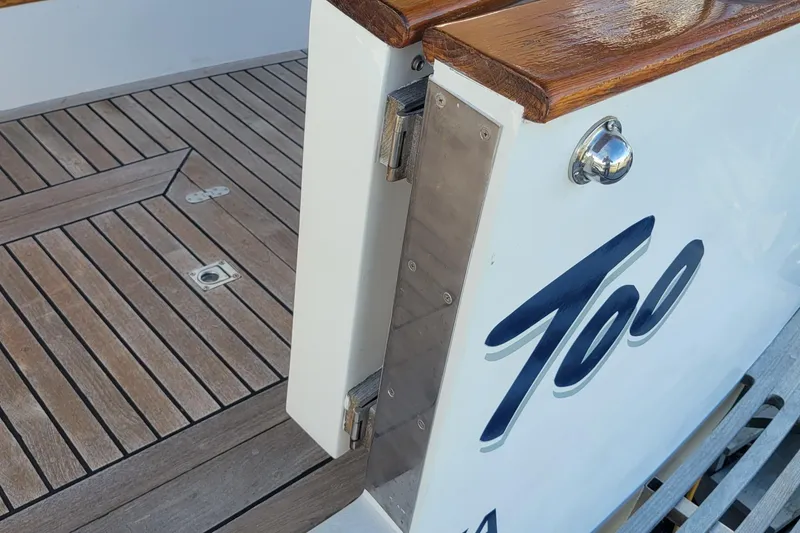 Slide: The Image of 1982 CHB Oceans boat deck with wooden flooring and metal fittings. - 21