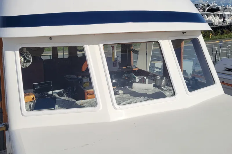 Slide: The Image of 1982 CHB Oceans boat cabin with navigation equipment and interior view. - 28