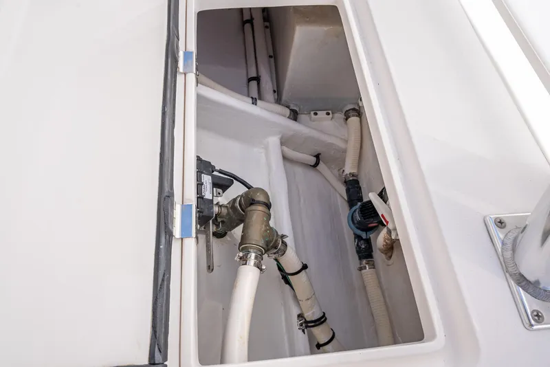 Slide: The Image of Intrepid 400 Center Console 2017 boat plumbing system with visible pipes and fittings. - 16