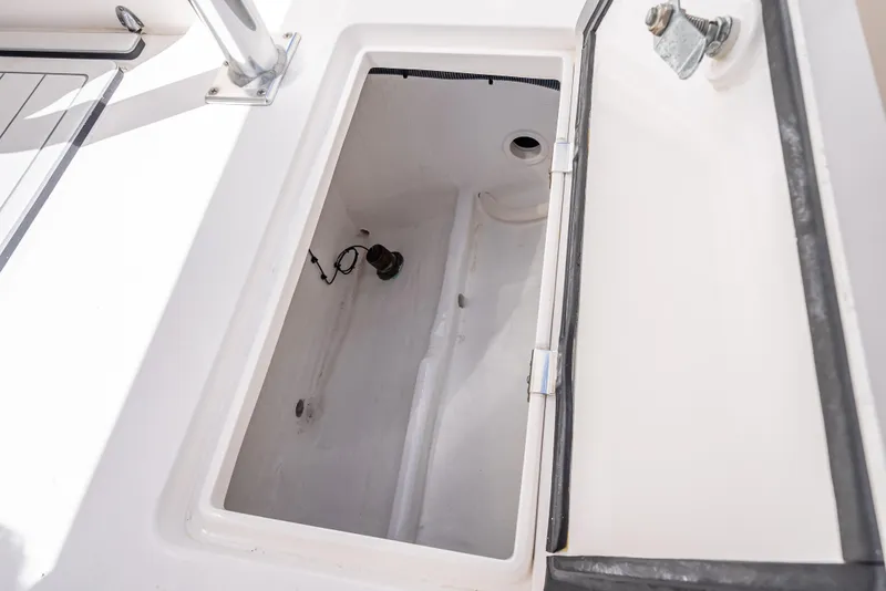 Slide: The Image of Open storage compartment on 2017 Intrepid 400 Center Console boat. - 17