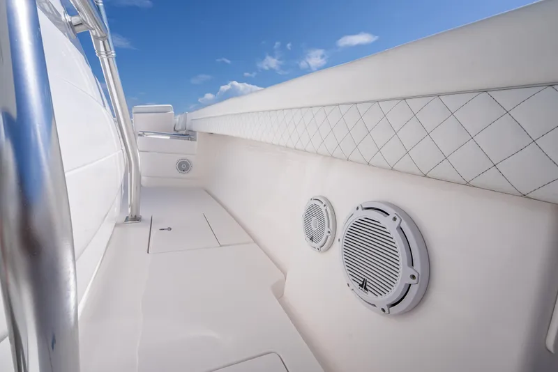 Slide: The Image of 2017 Intrepid 400 Center Console boat interior with speakers and quilted paneling. - 18