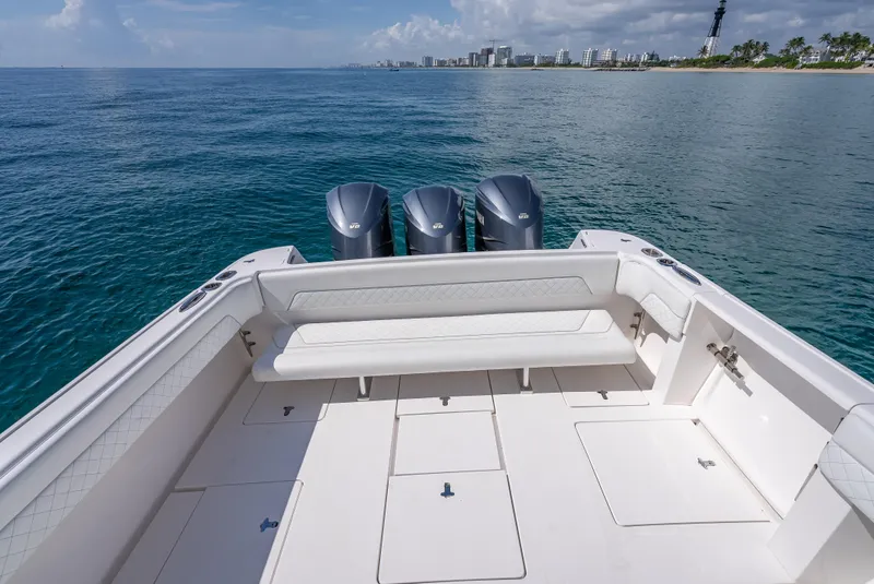 Slide: The Image of 2017 Intrepid 400 Center Console boat with triple engines on open water. - 20