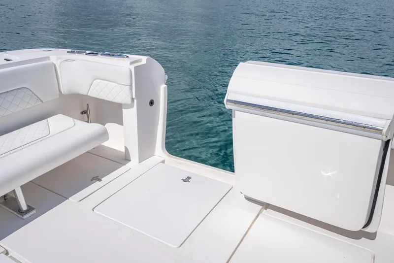 Slide: The Image of 2017 Intrepid 400 Center Console boat interior with white seating and ocean view. - 24