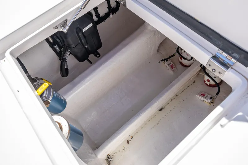 Slide: The Image of Storage compartment of 2017 Intrepid 400 Center Console boat, featuring electrical components. - 30