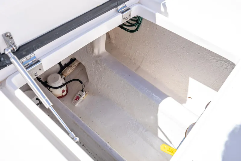 Slide: The Image of Open storage compartment of 2017 Intrepid 400 Center Console boat. - 31