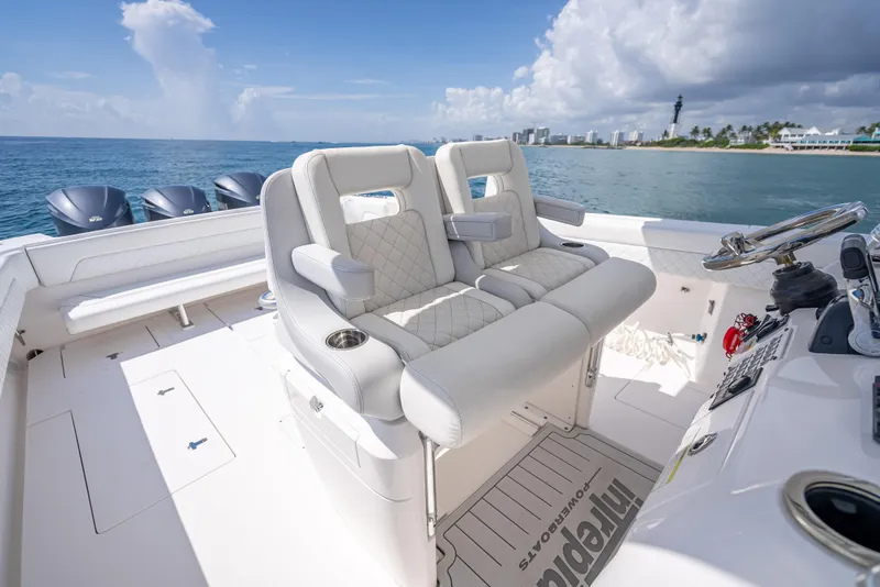 Slide: The Image of 2017 Intrepid 400 Center Console boat interior with plush seating and ocean view. - 43
