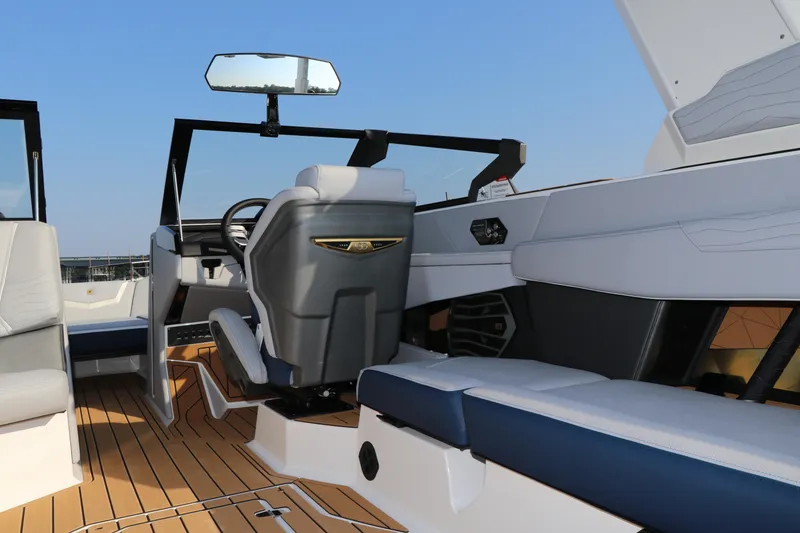 Slide: The Image of 2025 Nautique G25 boat interior with modern seating and sleek design. - 16