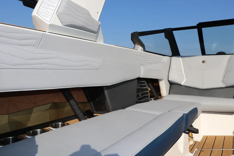 Slide: The Image of 2025 Nautique G25 boat interior with sleek seating and modern design. - 17