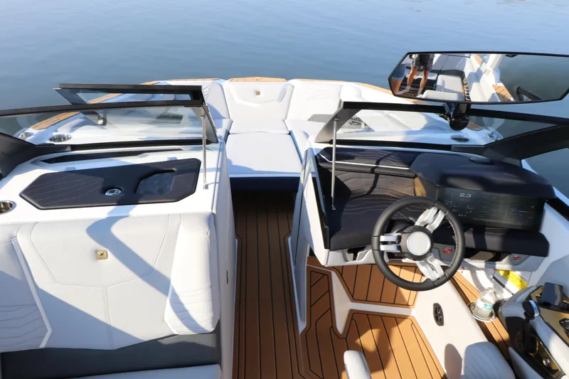 Slide: The Image of 2025 Nautique G25 boat interior with sleek design and modern dashboard. - 9