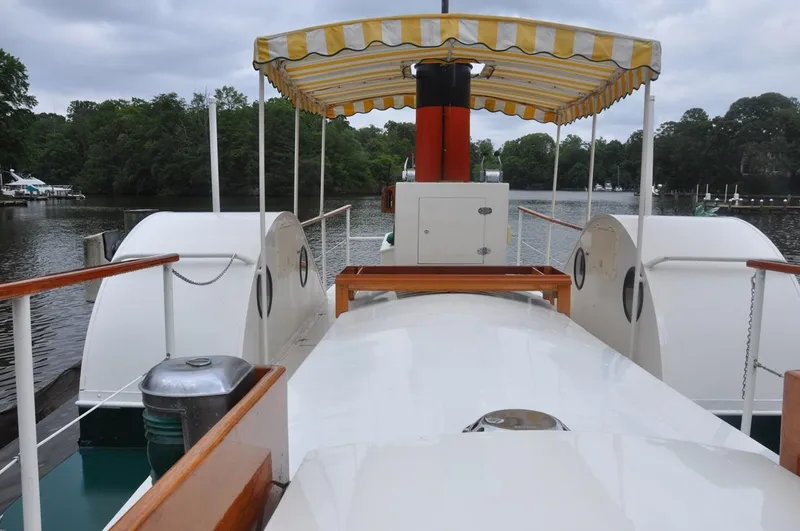 Slide: The Image of Custom 1987 sidewheel paddle yacht with canopy on a serene river. - 18